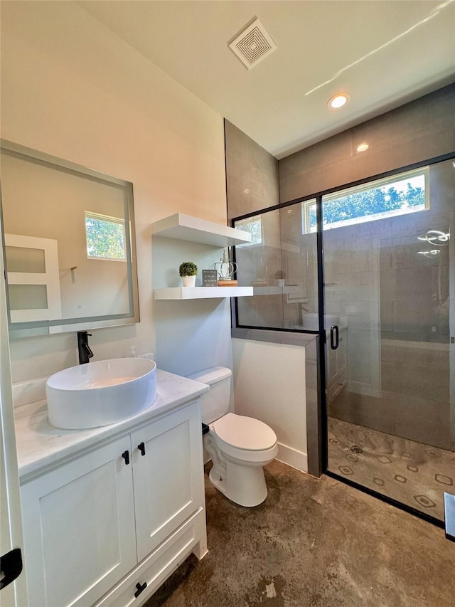 166 Oak Ridge Loop, Whitney, TX 76692 - bathroom featuring plenty of natural light, a shower stall, vanity, and toilet