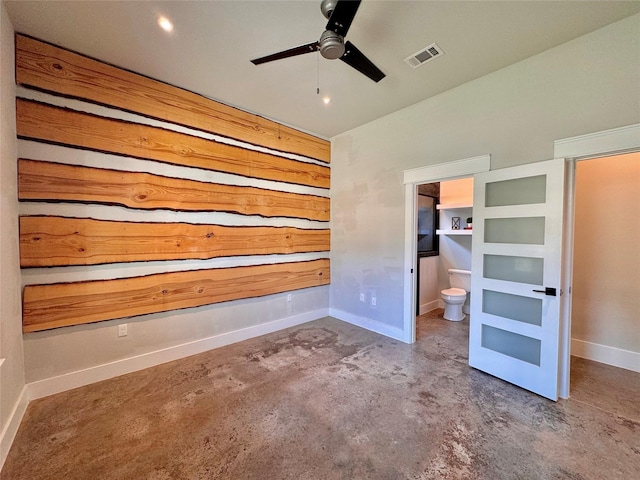 166 Oak Ridge Loop, Whitney, TX 76692 - unfurnished bedroom with unfinished concrete flooring, vaulted ceiling, connected bathroom, and baseboards