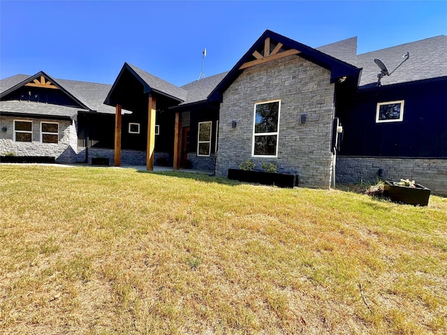166 Oak Ridge Loop, Whitney, TX 76692 - view of front of home with stone siding and a front lawn