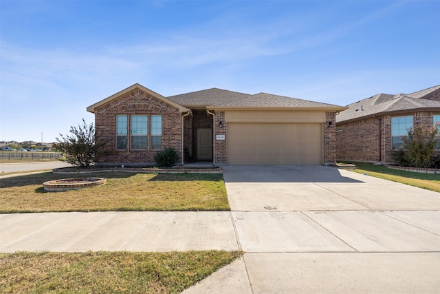 ranch-style home with a front yard and a garage