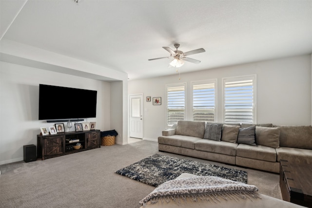 living room featuring carpet floors and ceiling fan