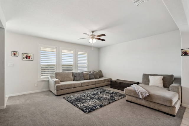 carpeted living room featuring ceiling fan