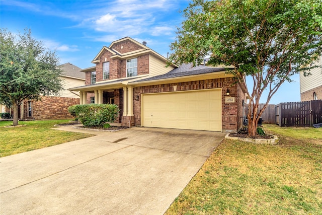 view of front of house featuring a front lawn and a garage