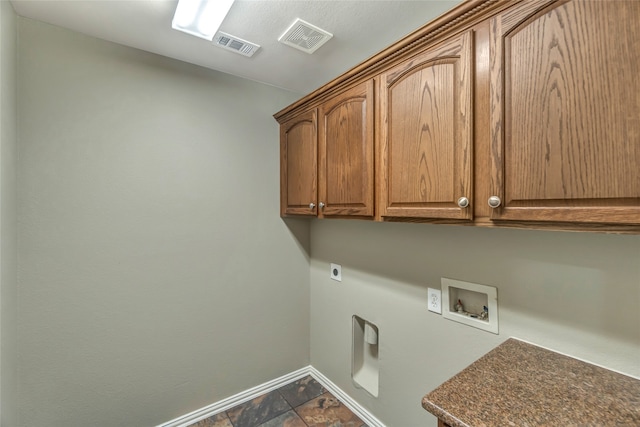 laundry room featuring washer hookup, cabinet space, visible vents, hookup for an electric dryer, and baseboards