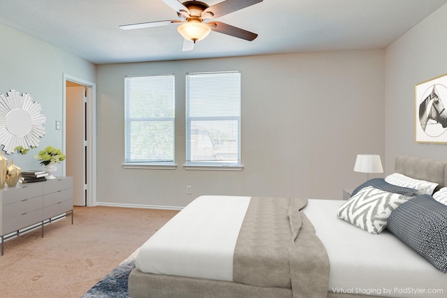 bedroom with carpet flooring, a ceiling fan, and baseboards