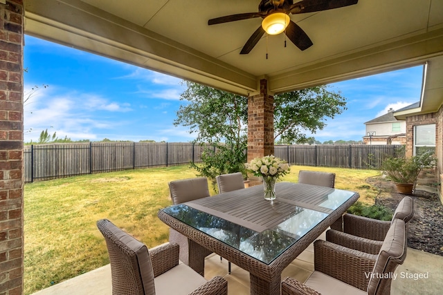 view of patio / terrace featuring a ceiling fan, outdoor dining area, and a fenced backyard