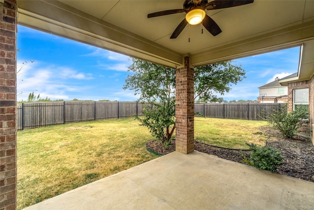 view of yard featuring a ceiling fan, a patio area, and a fenced backyard