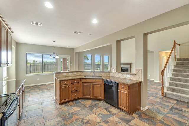 kitchen with visible vents, dishwasher, electric range, and a sink