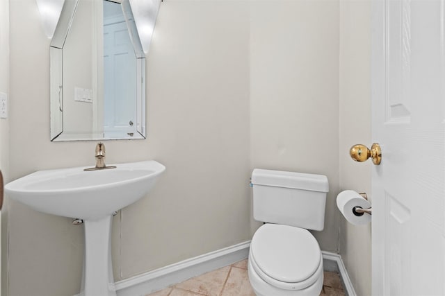 bathroom with tile patterned floors and toilet