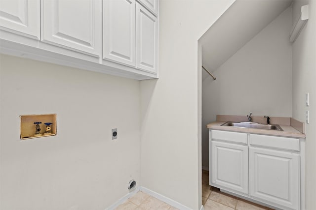 clothes washing area featuring sink, cabinets, washer hookup, light tile patterned floors, and hookup for an electric dryer