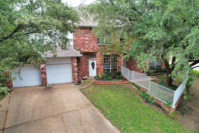 view of front of house with a garage and a front yard