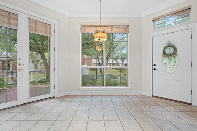 foyer featuring ornamental molding and light tile patterned flooring