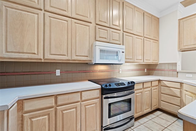 kitchen with electric stove, crown molding, light tile patterned floors, and light brown cabinets