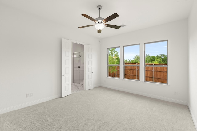 3601 Long Branch Blvd, Rowlett, TX 75088 - unfurnished bedroom with light carpet, baseboards, connected bathroom, and a ceiling fan