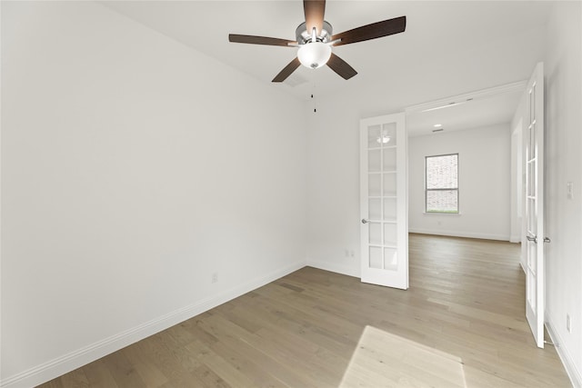 3601 Long Branch Blvd, Rowlett, TX 75088 - unfurnished room with french doors, light wood-type flooring, baseboards, and a ceiling fan
