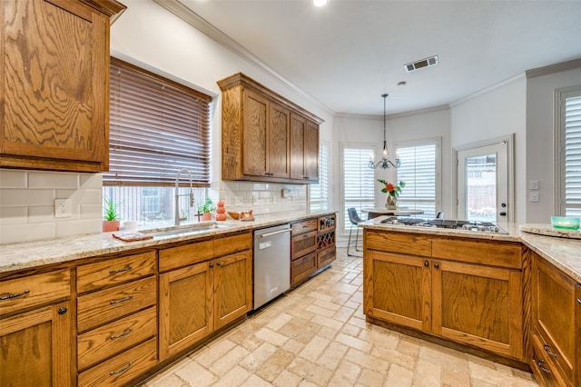 kitchen featuring light stone countertops, sink, appliances with stainless steel finishes, decorative backsplash, and an inviting chandelier