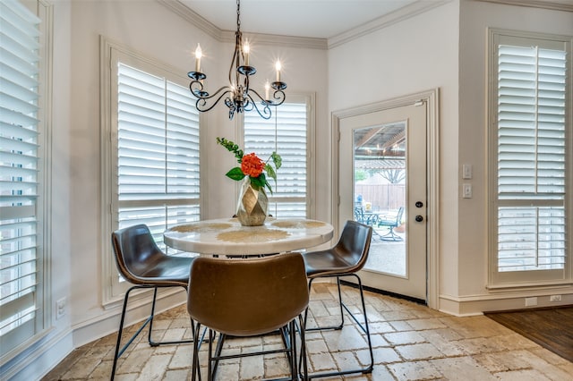 dining room featuring crown molding, a chandelier, and light hardwood / wood-style floors