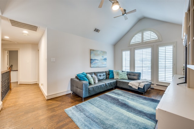 living room with ceiling fan, high vaulted ceiling, and hardwood / wood-style floors