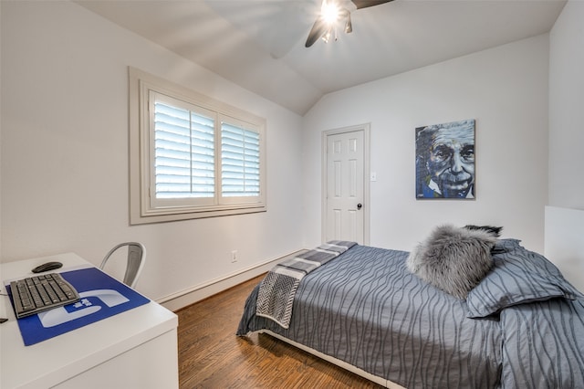 bedroom with ceiling fan, lofted ceiling, and dark hardwood / wood-style floors