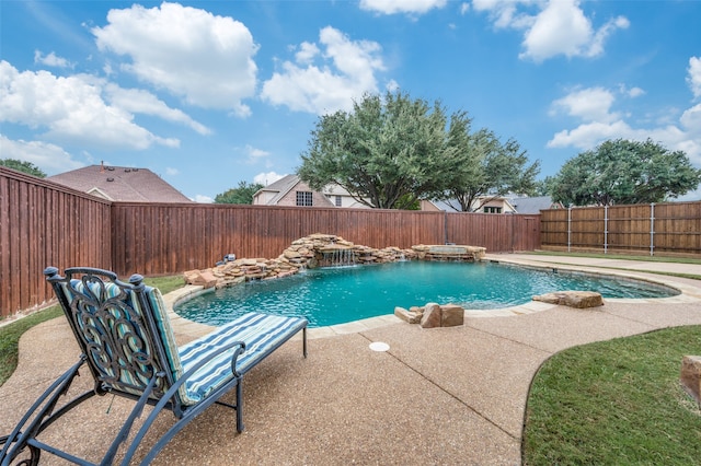 view of pool featuring pool water feature and a patio area