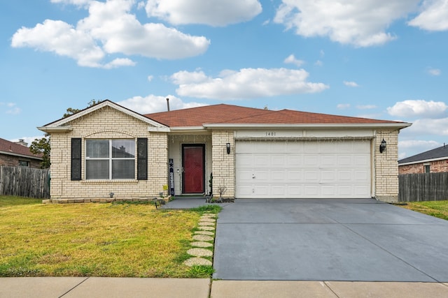 ranch-style home with a front yard and a garage