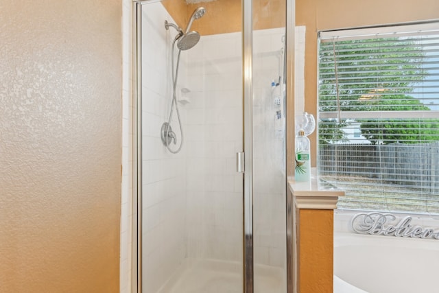 bathroom featuring plus walk in shower