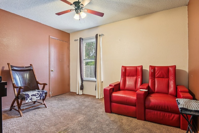 interior space featuring ceiling fan, carpet flooring, and a textured ceiling