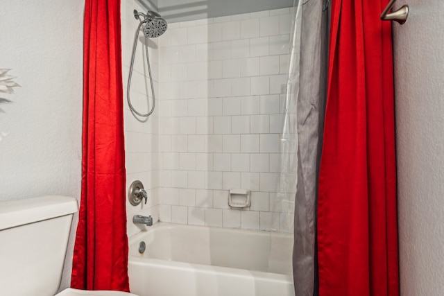 bathroom with toilet and shower / bath combo with shower curtain