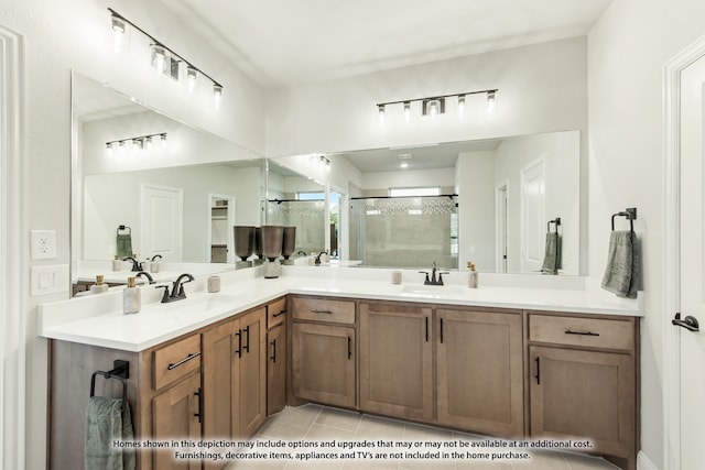 bathroom with vanity, a shower with shower door, and tile patterned flooring