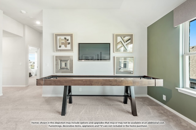 playroom featuring vaulted ceiling and light colored carpet