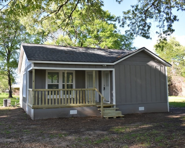 view of front of house featuring covered porch and cooling unit