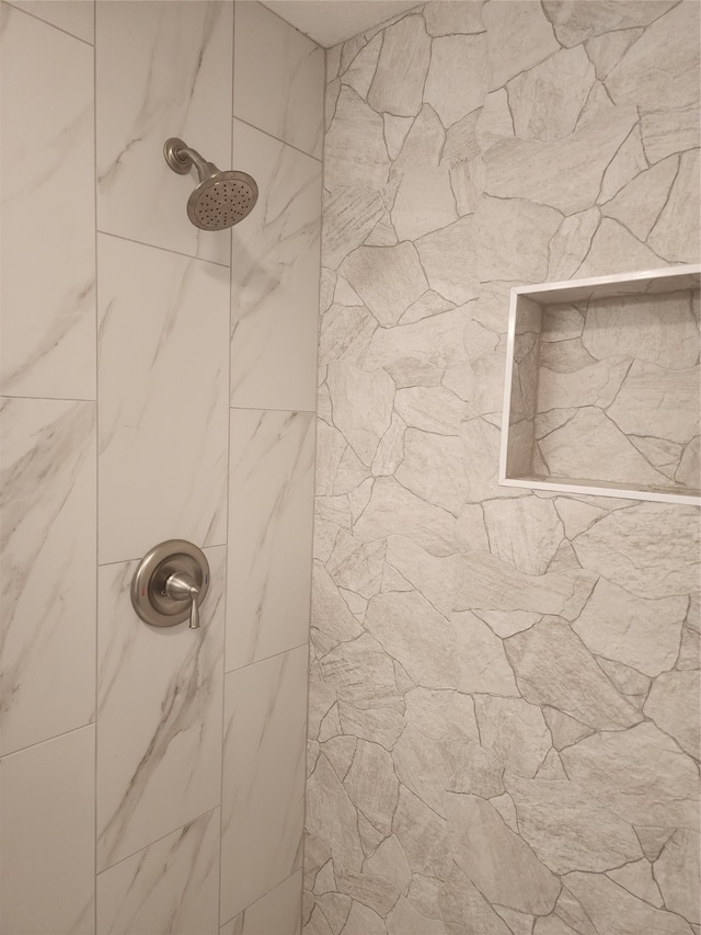 details with a tile shower