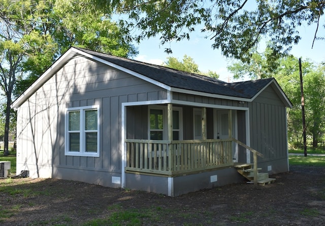 exterior space with a porch and central AC