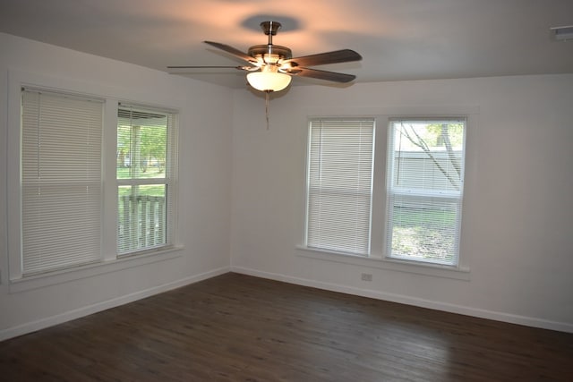 unfurnished room featuring ceiling fan and dark hardwood / wood-style flooring