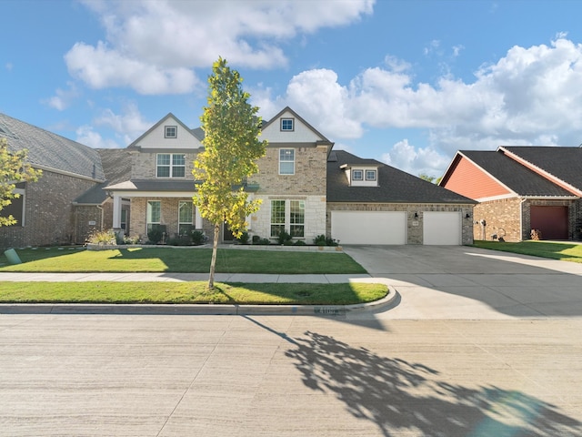 view of front of home with a front lawn and a garage