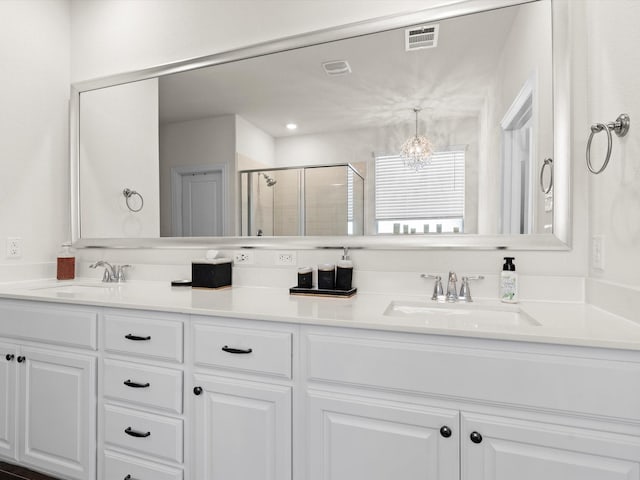 bathroom with walk in shower and vanity