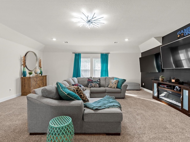 carpeted living room featuring a textured ceiling