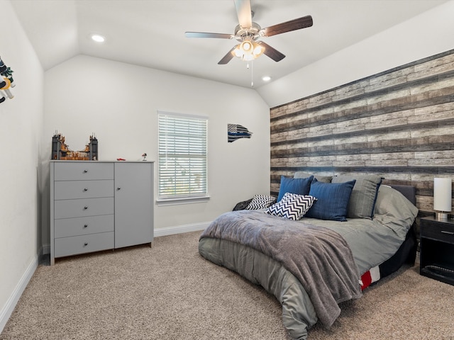 bedroom with vaulted ceiling, ceiling fan, and carpet