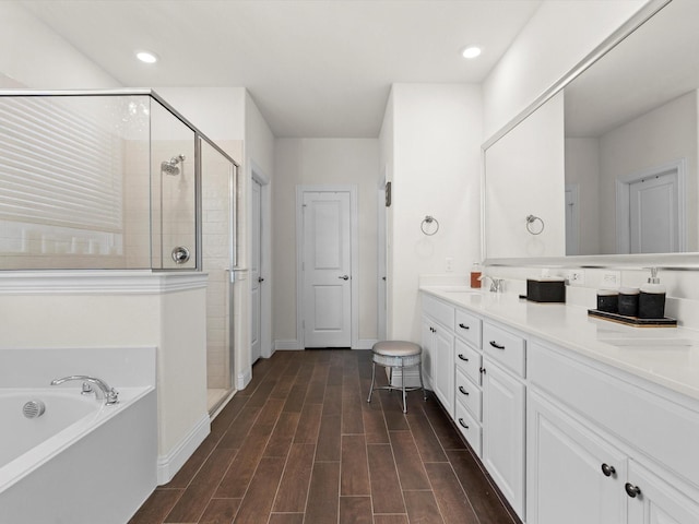 bathroom with independent shower and bath and vanity