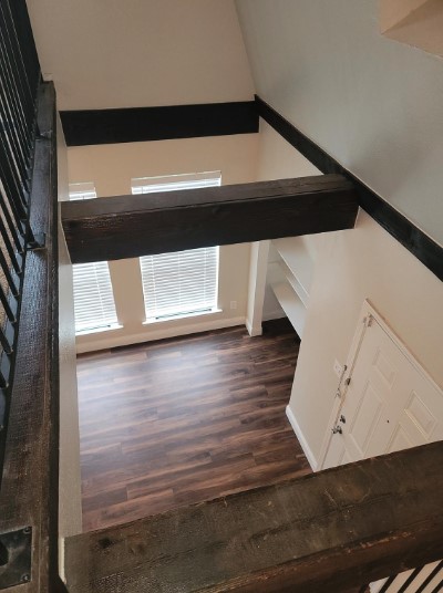 staircase featuring hardwood / wood-style floors