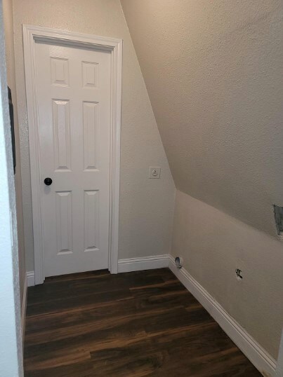 laundry room with dark hardwood / wood-style floors