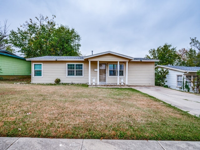 ranch-style home with a front lawn