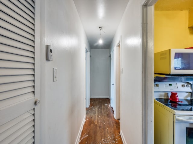 corridor with dark hardwood / wood-style floors