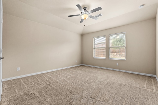 carpeted empty room featuring ceiling fan