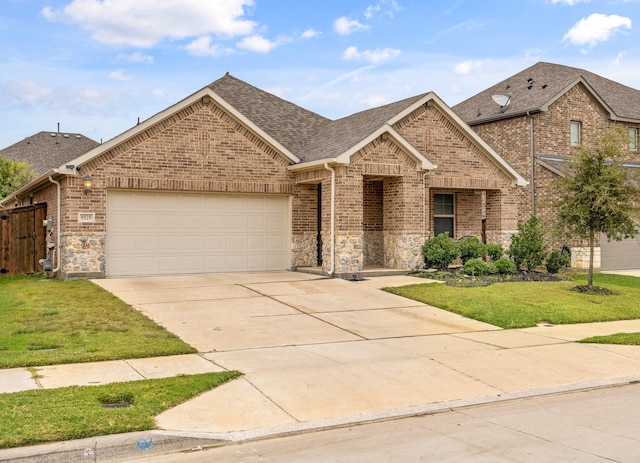 view of front of home featuring a front lawn and a garage