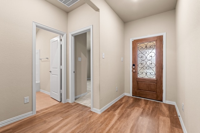 entrance foyer with light hardwood / wood-style floors