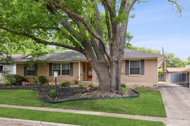 ranch-style home featuring a front yard