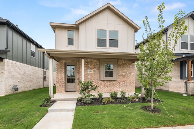 view of front of house featuring a porch and a front lawn