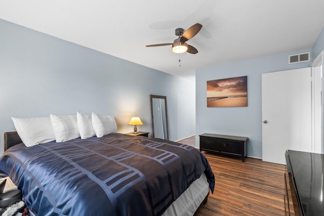 bedroom with ceiling fan and dark hardwood / wood-style flooring