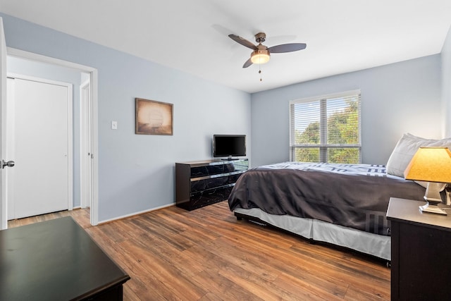 bedroom featuring hardwood / wood-style floors and ceiling fan